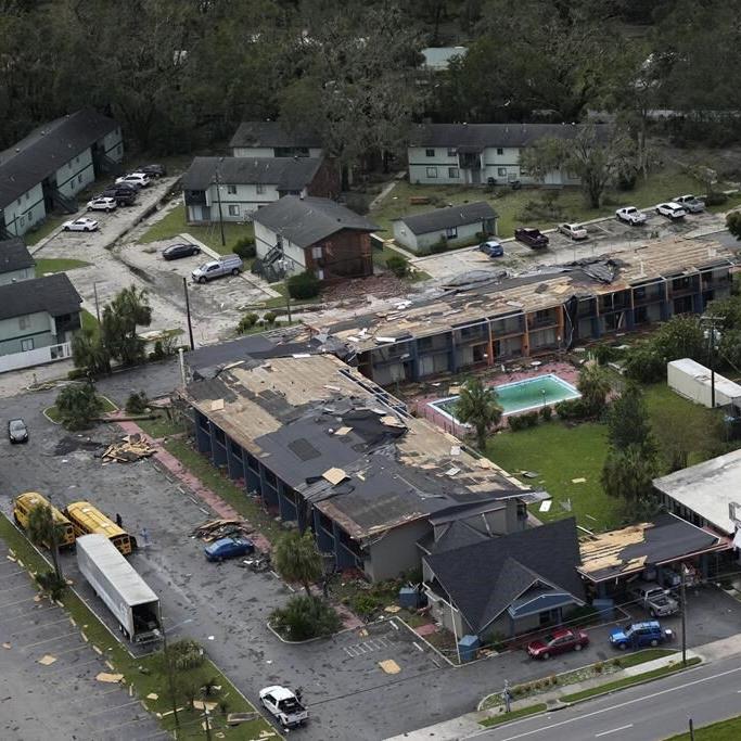 Residents pick through the rubble of lost homes and scattered belongings in Hurricane Idalia's wake
